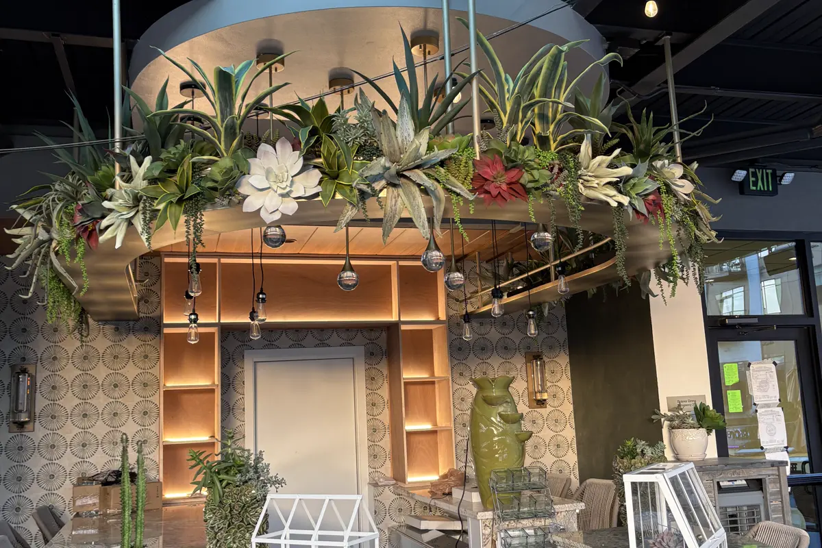 Decorative suspended steel feature above a restaurant bar